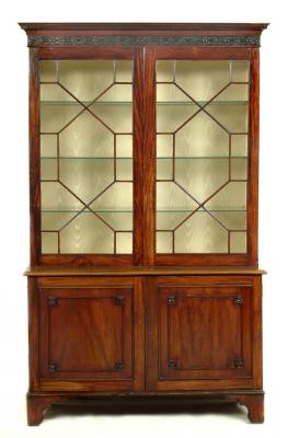 Appraisal: A MAHOGANY BOOKCASE CABINET of Georgian design th century and