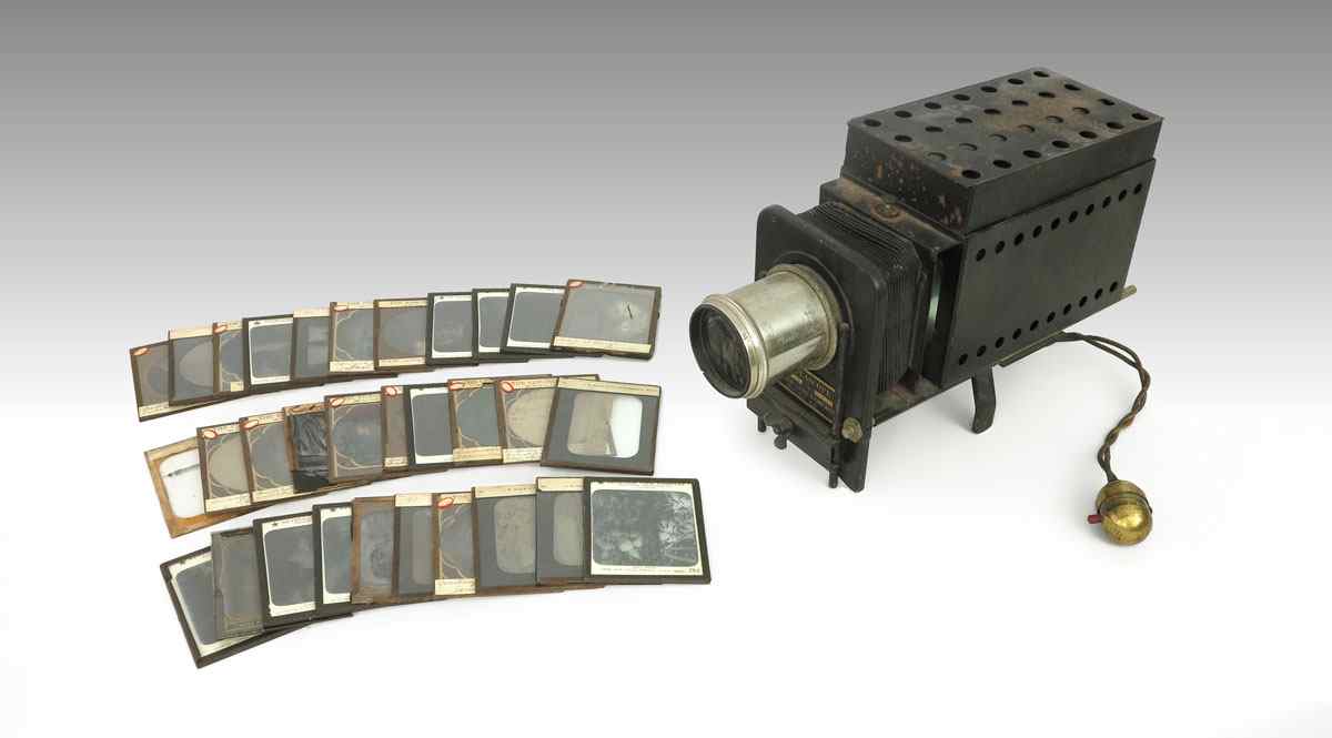 Appraisal: COLLECTION OF MAGIC LANTERN SLIDES WITH PROJECTOR Approx slides of