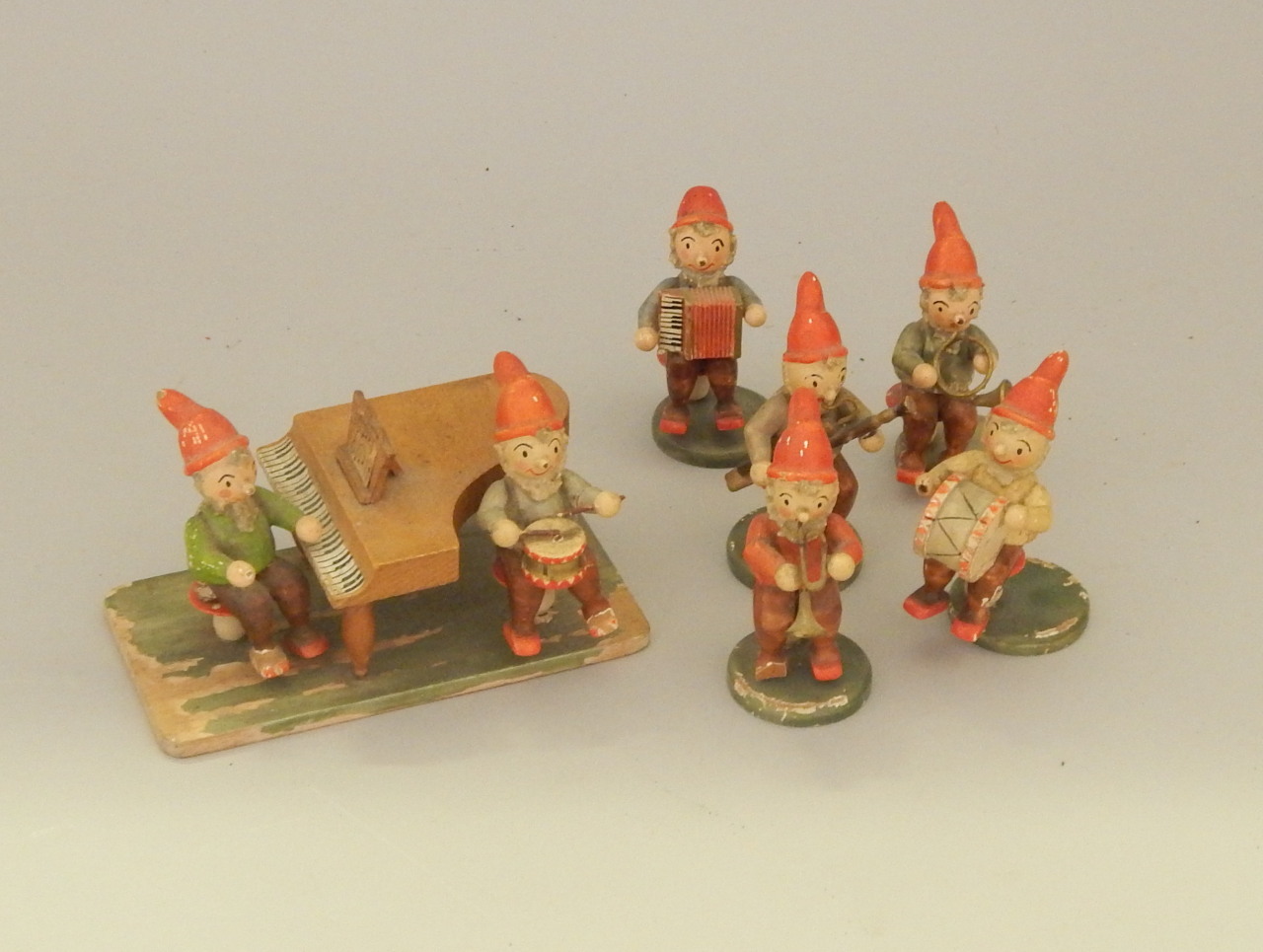 Appraisal: A collection of German Hedo painted wooden garden gnomes each