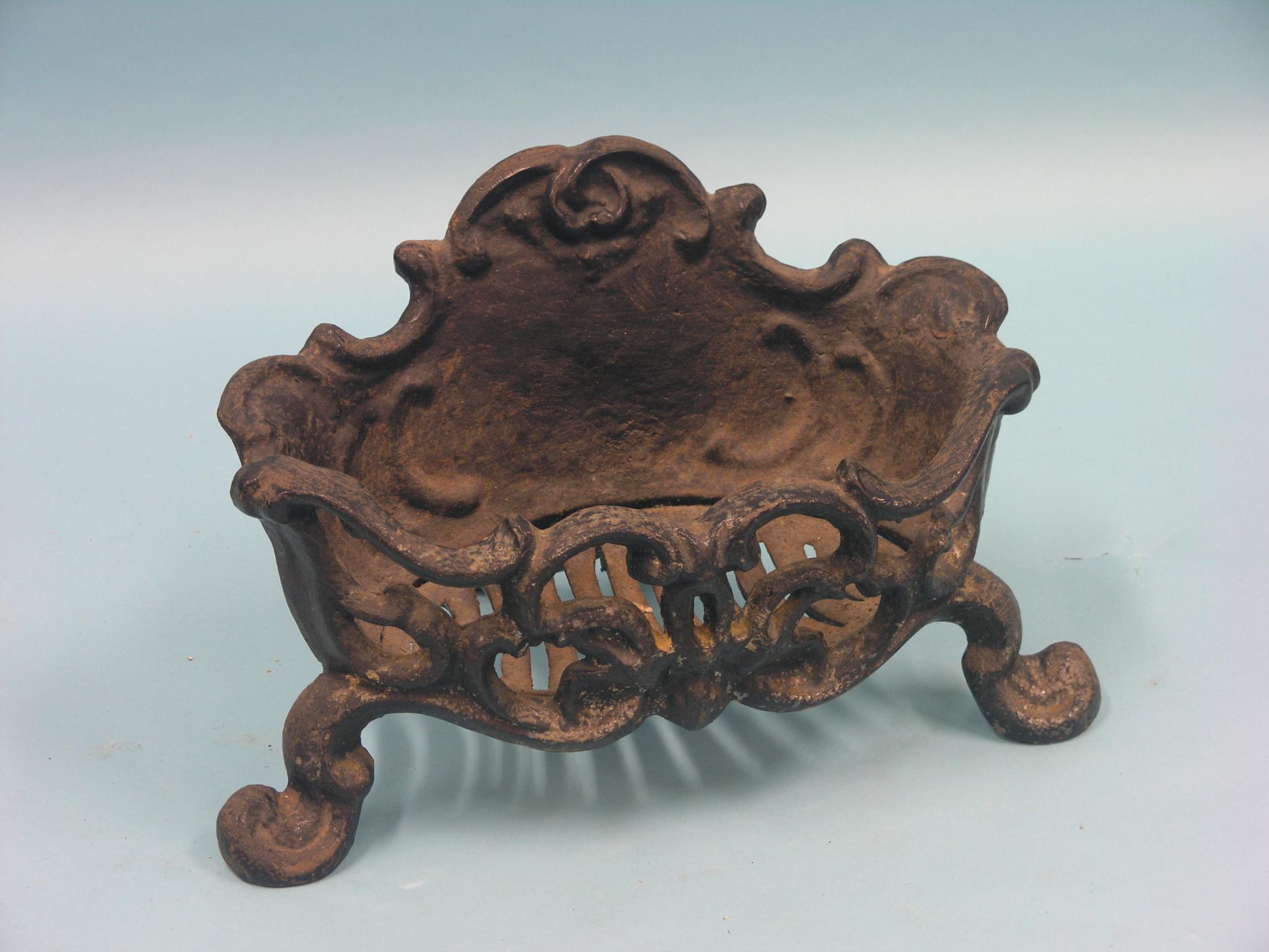 Appraisal: A Victorian cast iron fire-grate rococo form in wide