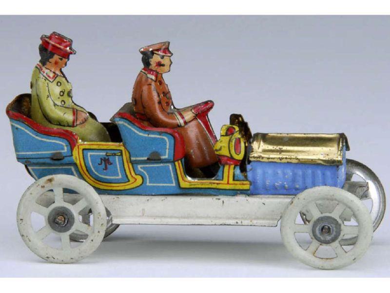 Appraisal: German Tin Penny Toy Automobile with Figures Description - ''