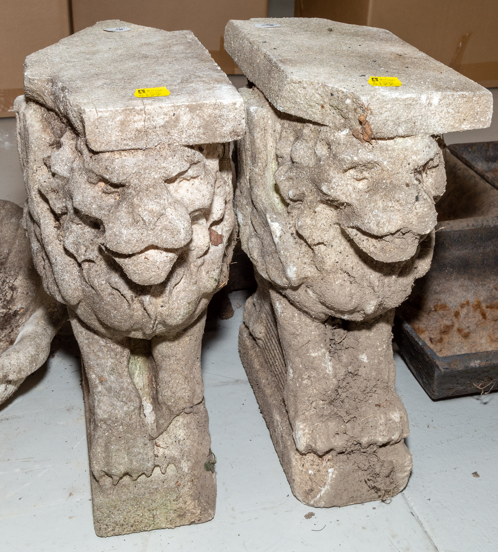 Appraisal: A PAIR OF CEMENT LION-FORM GARDEN BENCH SUPPORTS th century