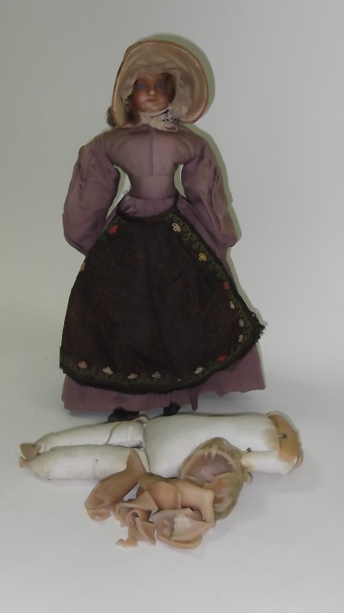 Appraisal: A mid th Century wax doll with blue eyes wearing