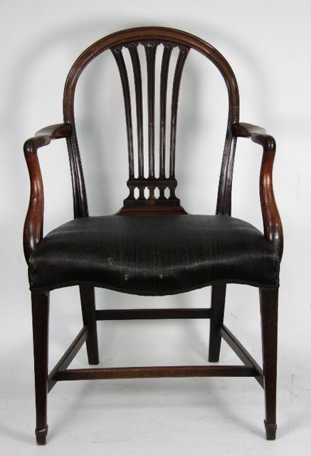 Appraisal: A matched pair of George III style mahogany armchairs the