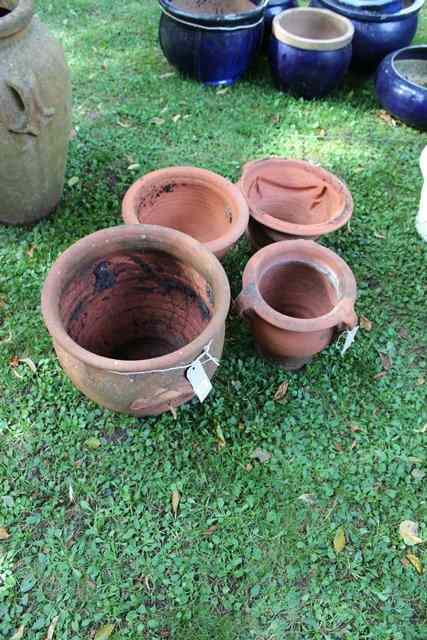 Appraisal: A TERRACOTTA PLANTER with two handles high together with three