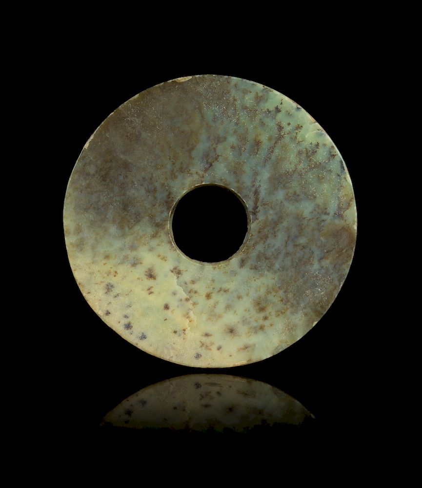 Appraisal: A Chinese Archaic Mottled Green Jade Bi Disk Diam in