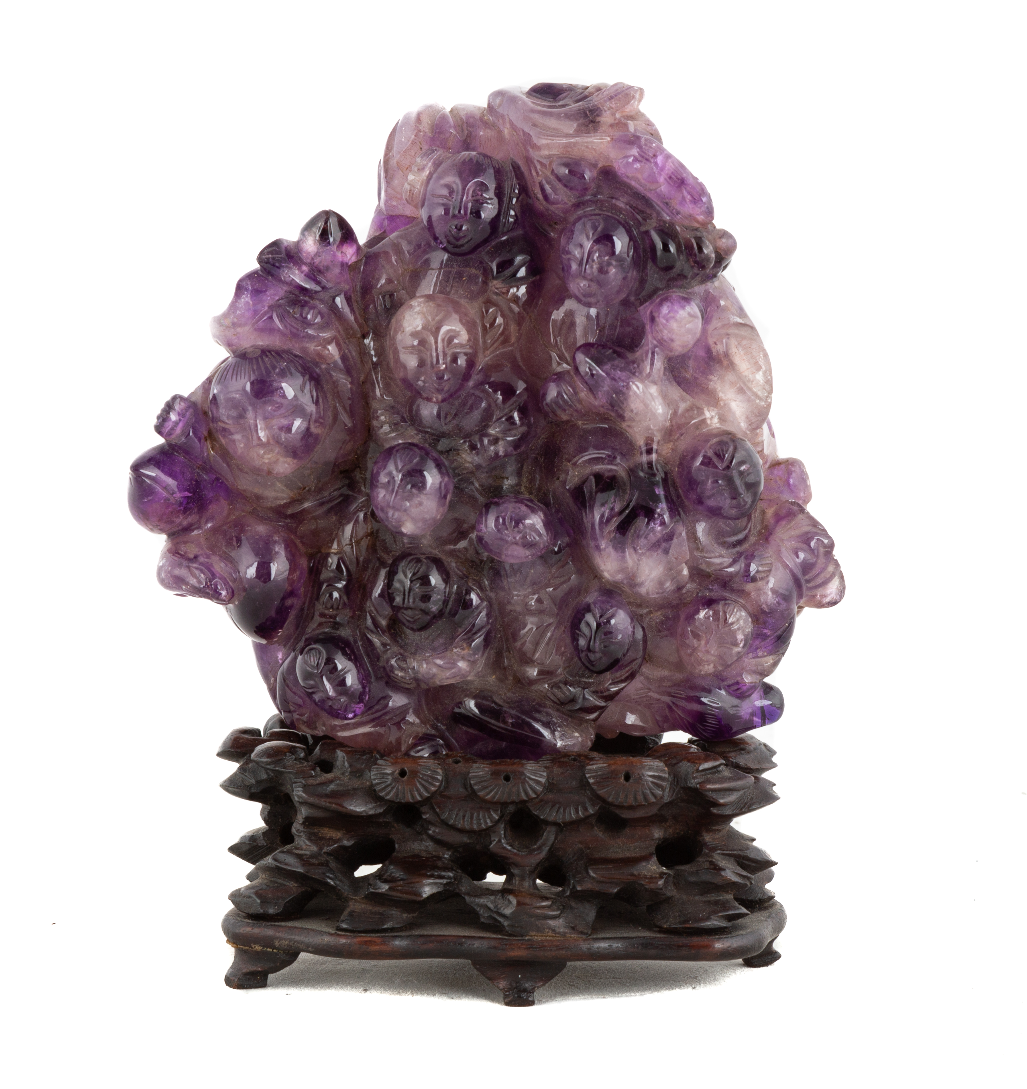 Appraisal: CHINESE CARVED AMETHYST THOUSAND FACES on carved teakwood base