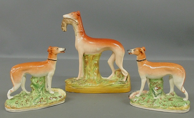 Appraisal: - Pair of Staffordshire standing whippets with game c and