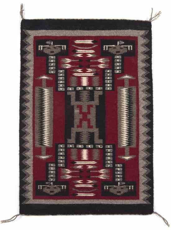 Appraisal: A Navajo Weaving Ganado with storm design having pictorial faces