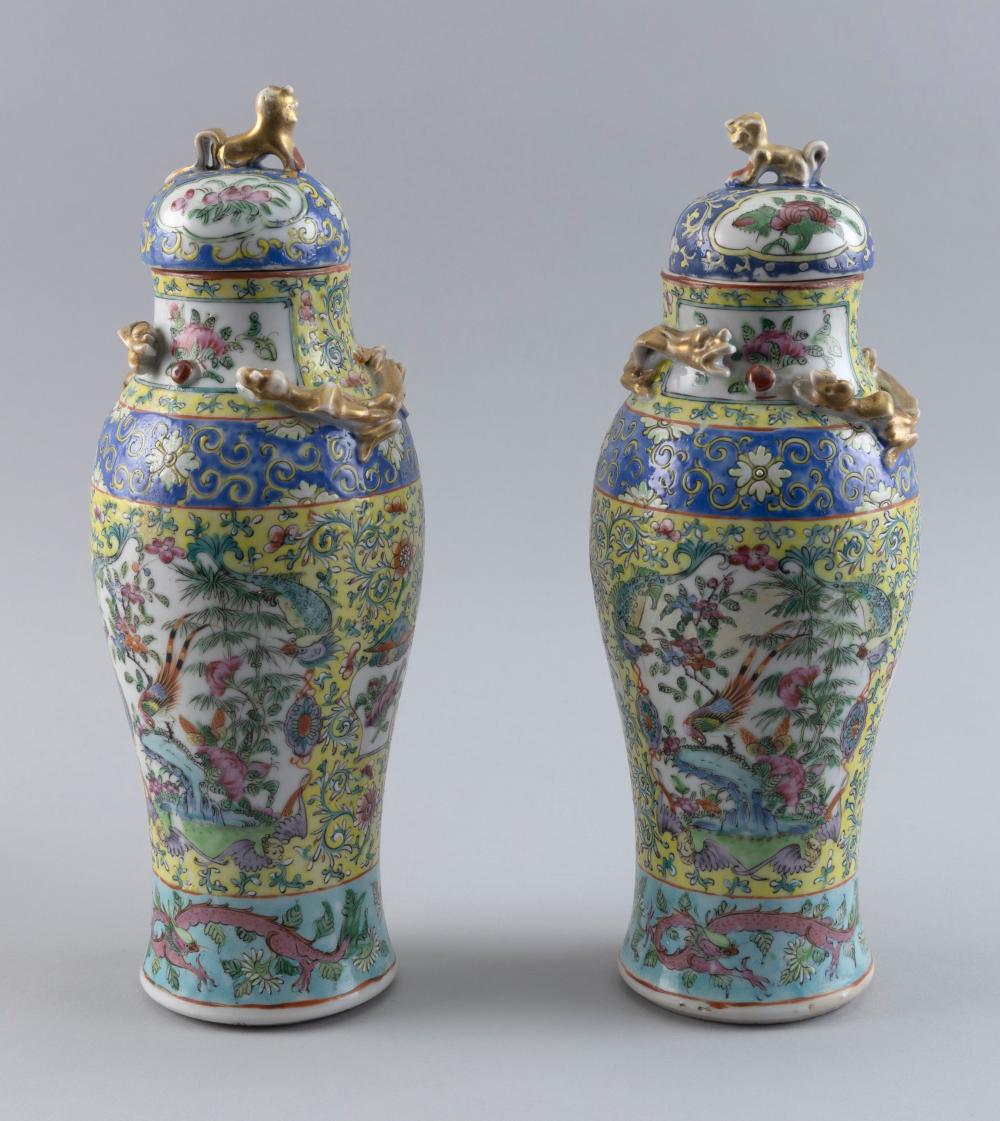 Appraisal: PAIR OF CHINESE FAMILLE ROSE PORCELAIN COVERED BALUSTER VASES LATE