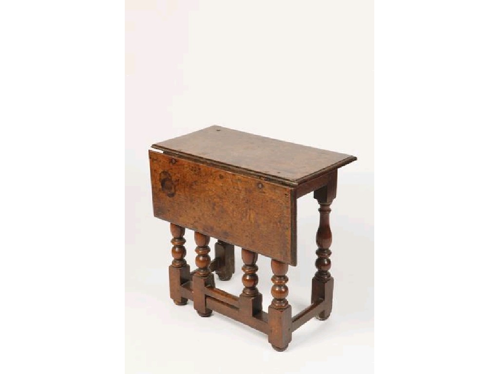 Appraisal: A CHARLES II OAK SINGLE FLAP TABLE the rectangular top