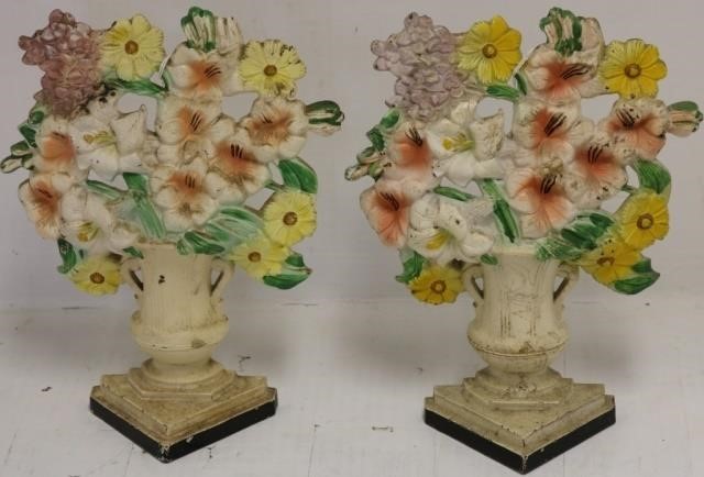 Appraisal: PAIR OF MATCHING EARLY TH C CAST IRON DOORSTOPSFLOWERS IN