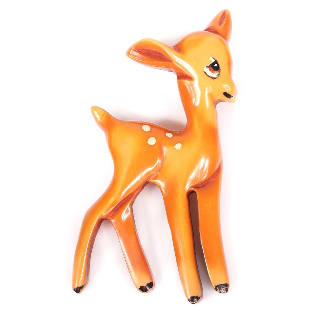 Appraisal: VINTAGE CARVED BAKELITE DISNEY''S BAMBI OVERDYED BUTTERSCOTCH FIGURAL DEER PIN