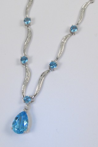 Appraisal: BLUE TOPAZ AND DIAMOND NECKLACE k white gold and set