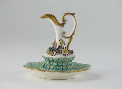 Appraisal: An English bone china miniature ewer and stand encrusted with