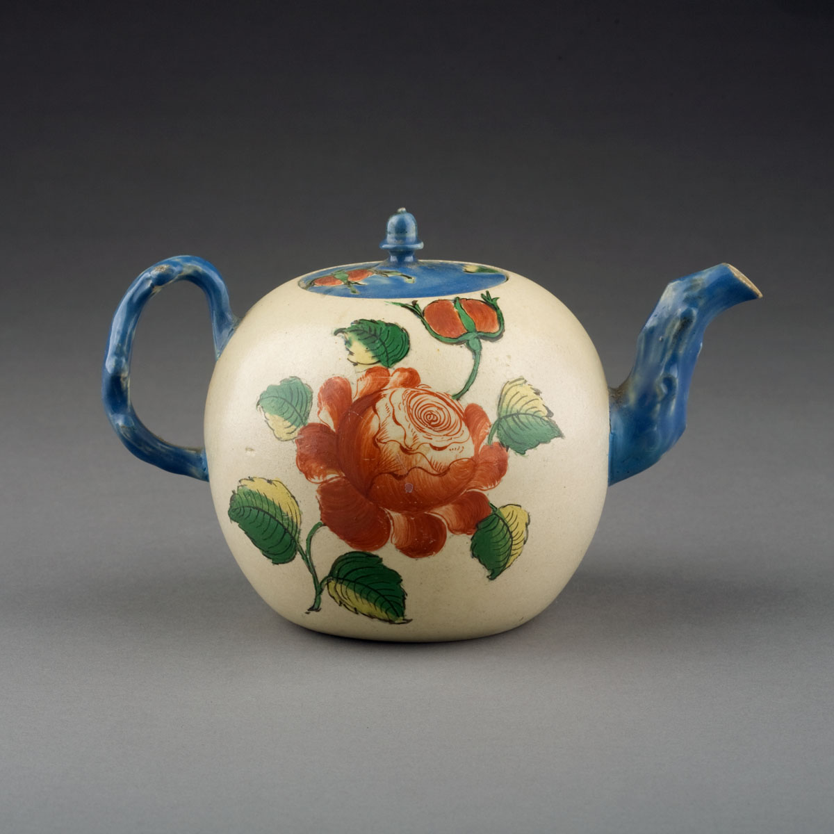 Appraisal: STAFFORDSHIRE SALTGLAZE ENAMELLED TEAPOT AND COVER Of ovoid form with