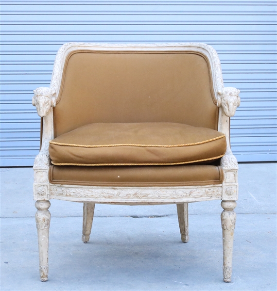 Appraisal: Carved wood and upholstered arm chair ram carved handles to