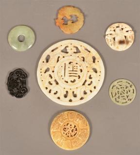 Appraisal: Seven Various Jade Discs and Medallions Largest diam