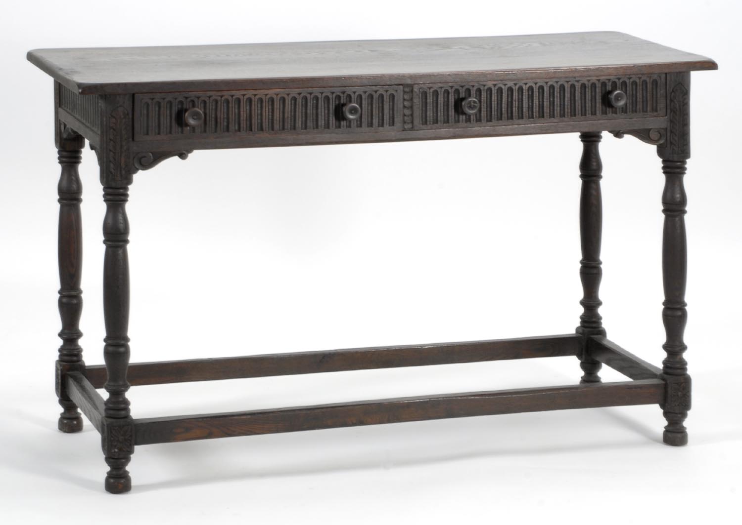 Appraisal: CARVED OAK SERVING TABLE with two half-drawers and turned legs