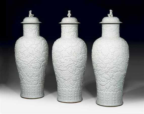 Appraisal: SET OF THREE COVERED VASES WITH MOULDED DESIGN UNDER LIGHT