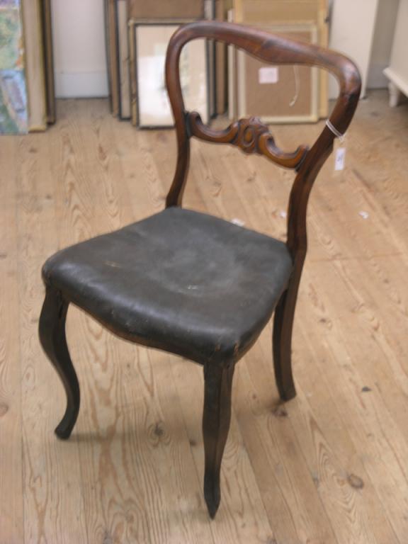 Appraisal: A Victorian Rosewood balloon-back dining chair with carved bar-back on