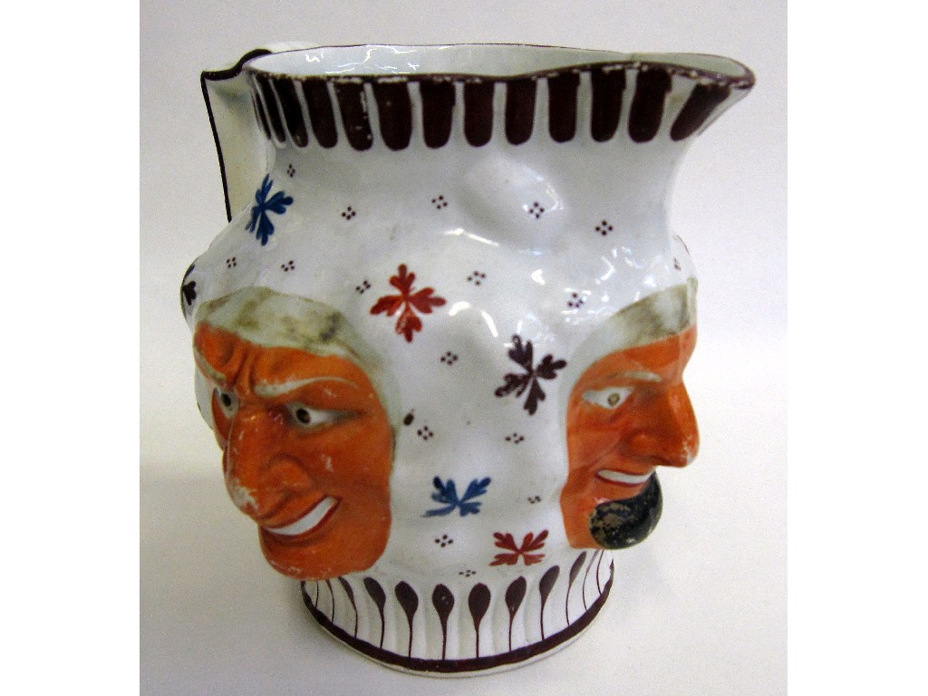 Appraisal: th century Staffordshire pottery jug decorated with three Bacchus masks