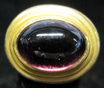 Appraisal: karat yellow gold cabochon tourmaline ringBezel set with radiating gold