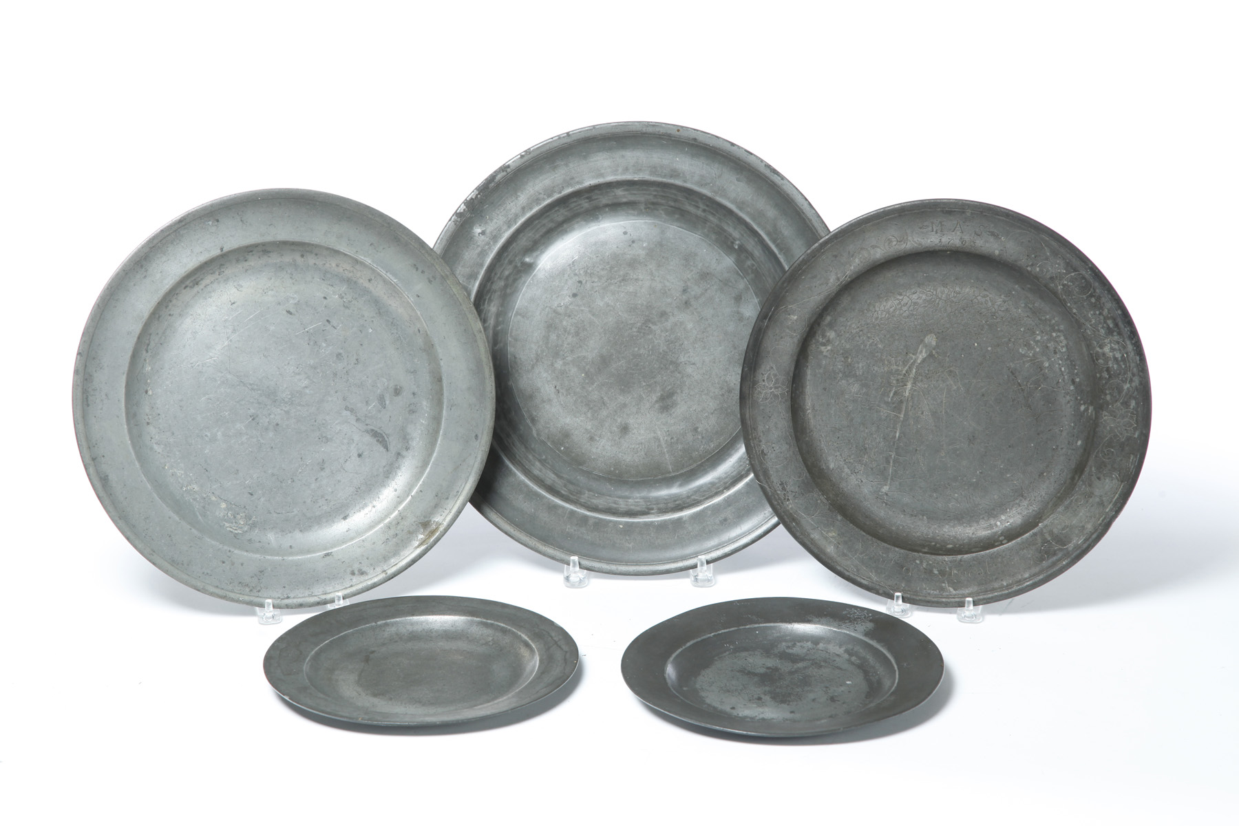 Appraisal: FIVE PEWTER PLATES AND CHARGERS European late th- th century