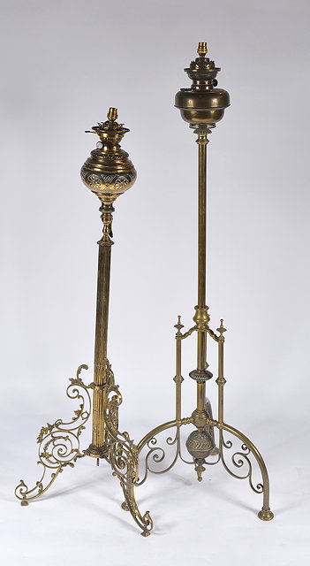 Appraisal: A Victorian brass column standard lampwith scroll aesthetic type base