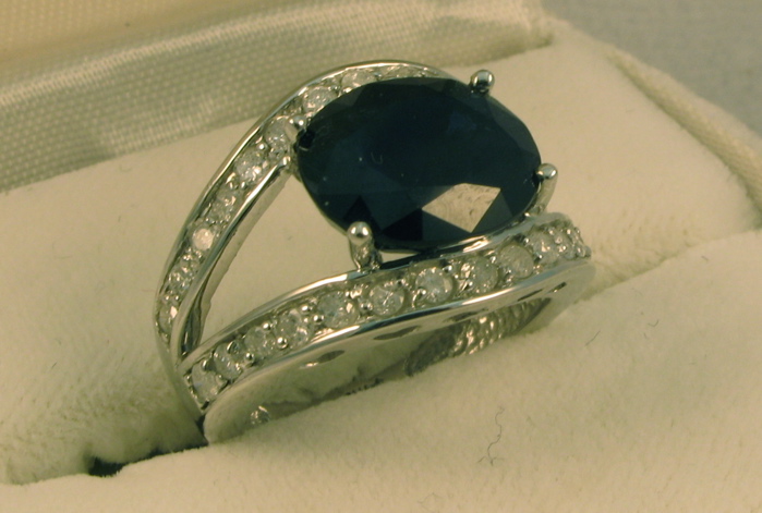 Appraisal: SAPPHIRE DIAMOND AND FOURTEEN KARAT WHITE GOLD RING WITH APPRAISAL