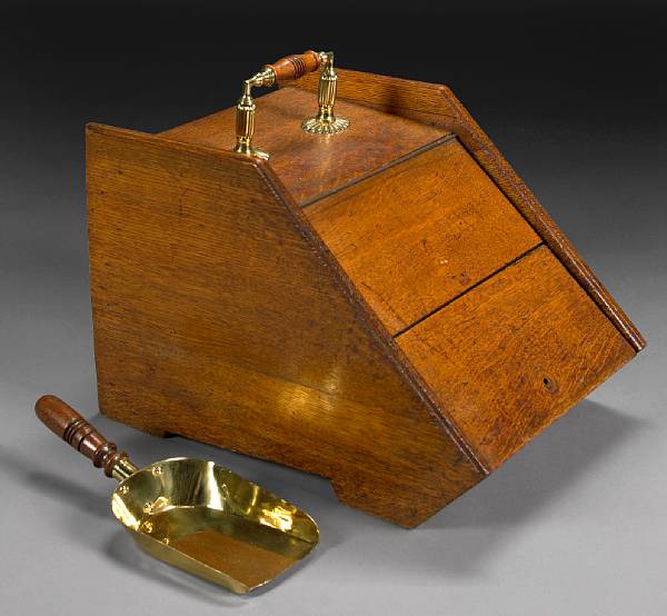 Appraisal: An oak and brass coal scuttle height in