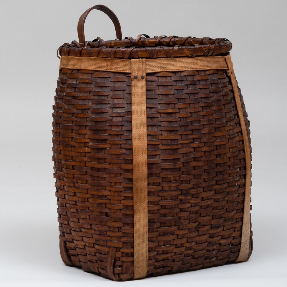 Appraisal: Adirondack Guide Woven Reed Backpack Fitted with cloth straps x