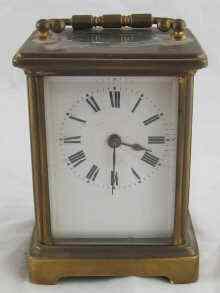 Appraisal: A brass cased carriage clock with white enamel dial Ht