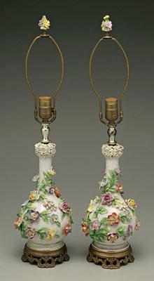 Appraisal: Pair porcelain lamps bottle form vases heavily encrusted with flowers