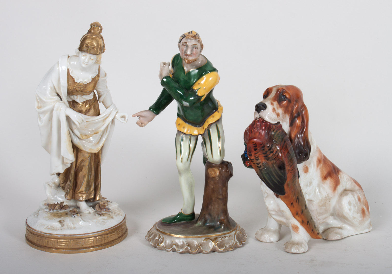 Appraisal: Three ceramic figures including Royal Doulton china spaniel carrying pheasant