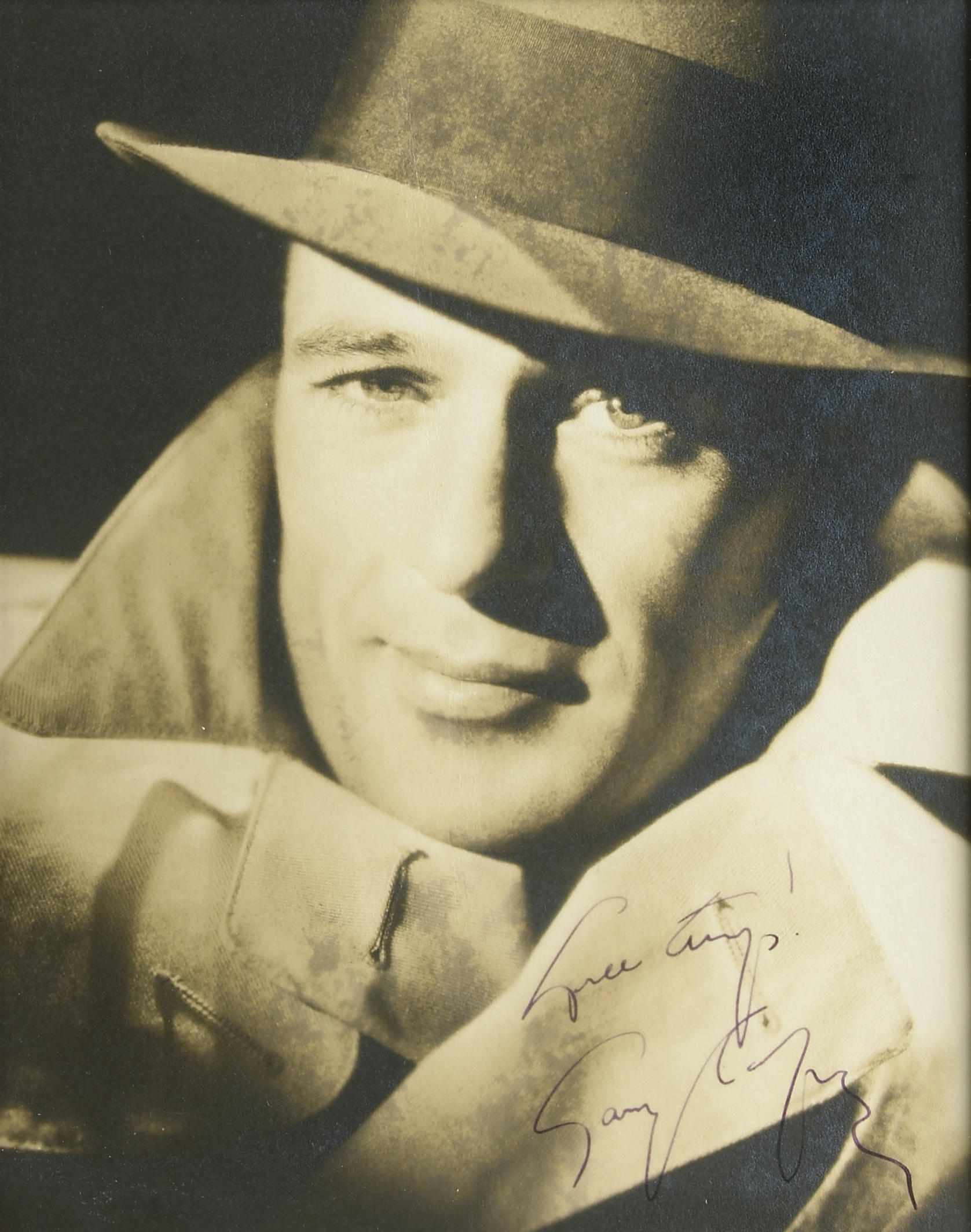 Appraisal: Gary Cooper signed photograph A vintage silver gelatin sepia tone