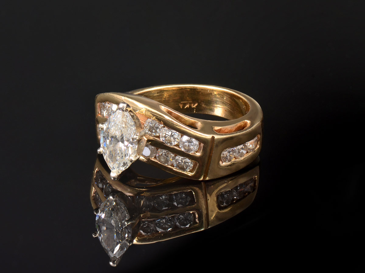 Appraisal: CT MARQUISE DIAMOND K yellow gold ring centering an approx