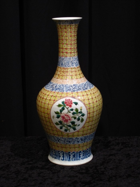 Appraisal: CHINESE FAMILLE ROSE BALUSTER VASE With peony roundrels reserved on