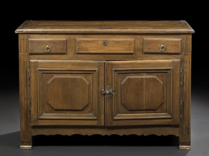 Appraisal: French Provincial Oak Buffet late th century the rectangular top