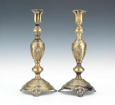 Appraisal: A Pair of Brass Candlesticks Prague th Century Repousee brass