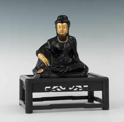 Appraisal: A Black Cast Glass Seated Guanyin Figure Apprx - H