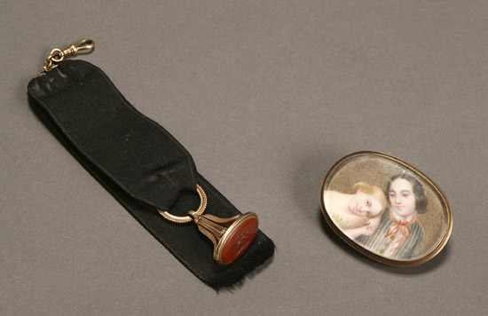 Appraisal: Victorian Miniature Portrait Brooch and a Carnelian Crested Watch Fob