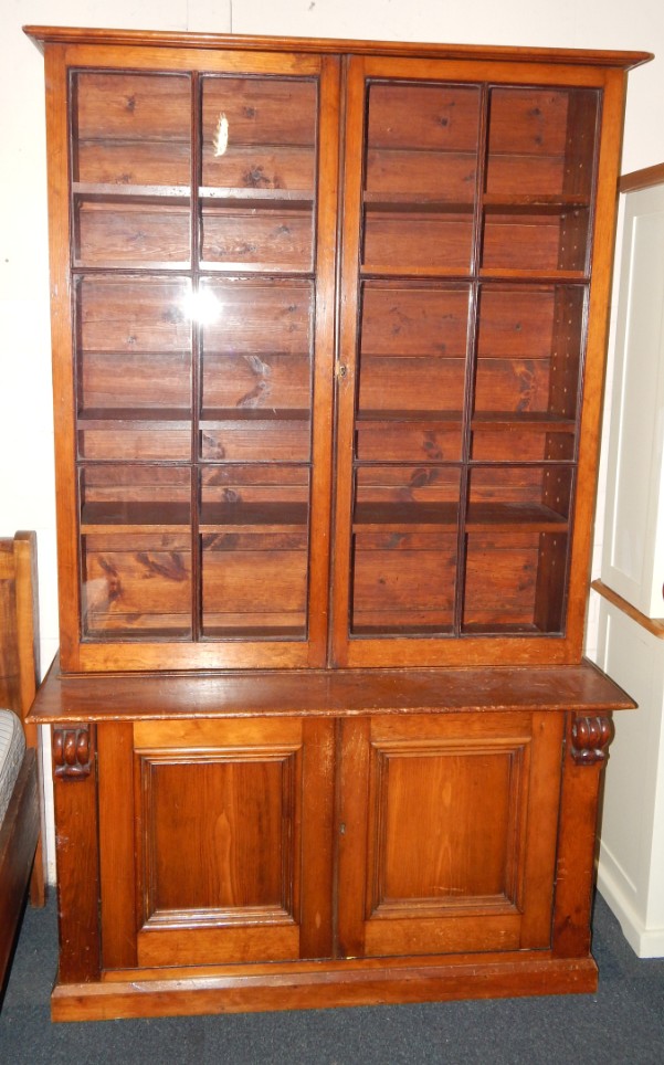 Appraisal: A Victorian mahogany cupboard bookcase the pediment over two glazed