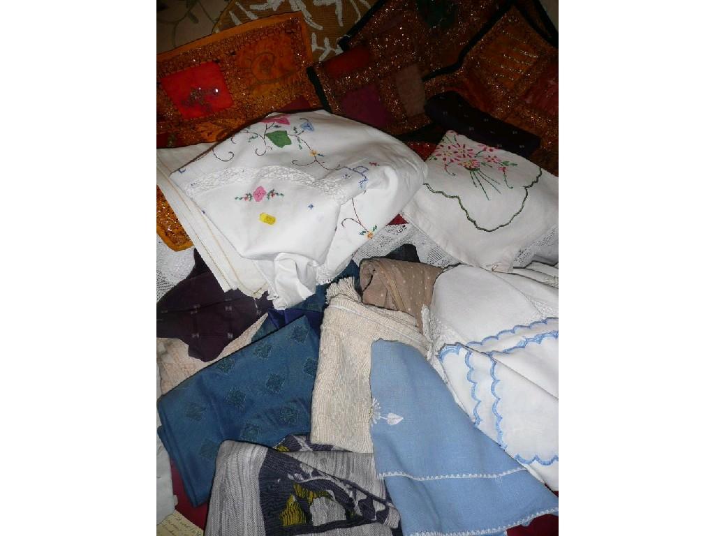 Appraisal: A quantity of embroidered and plain table cloths cushion covered