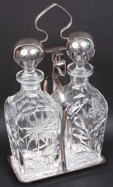 Appraisal: Tantalus English silver-plated cut and etched glass decanters with key