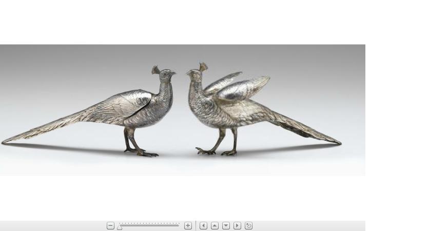 Appraisal: Pair of silver peacock modelsstamped solid silver