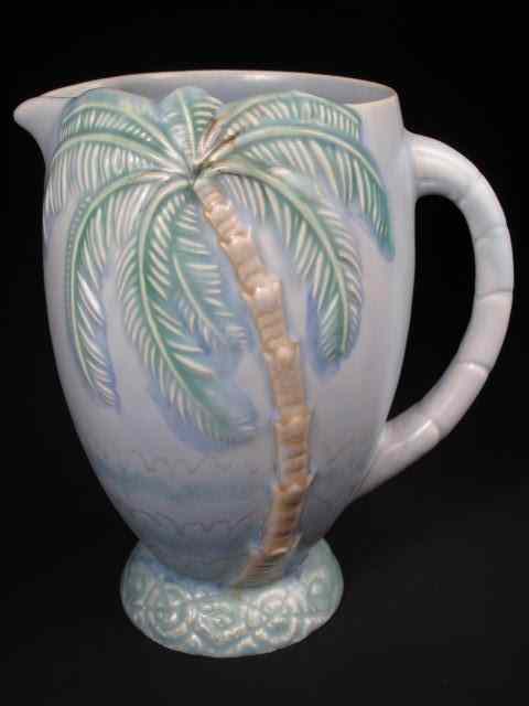 Appraisal: Beswick art pottery jug with relief palm tree and water