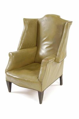 Appraisal: A wing armchair in George III style upholstered studded green