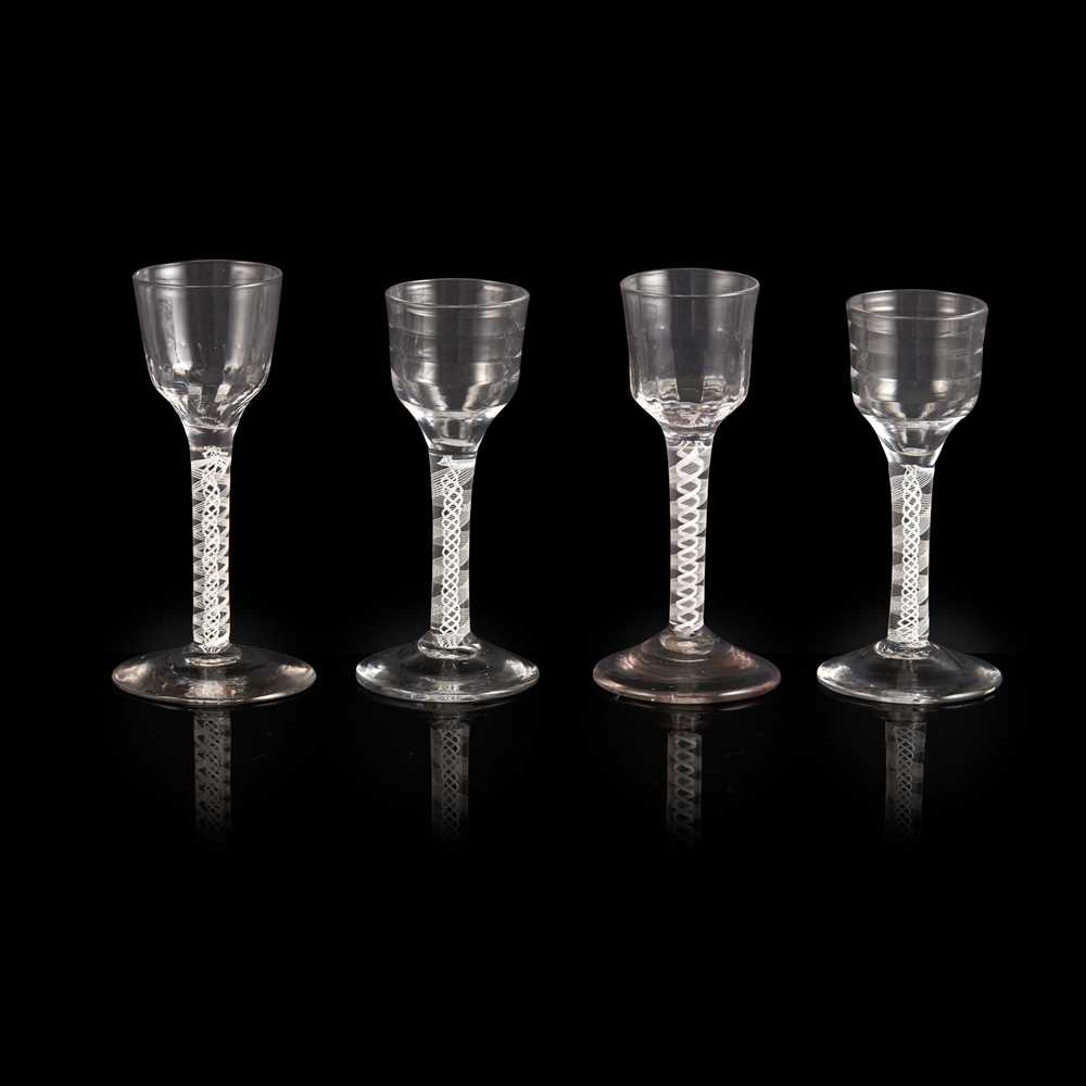 Appraisal: FOUR GEORGIAN OPAQUE-TWIST STEM WINE GLASSES MID TH CENTURY all