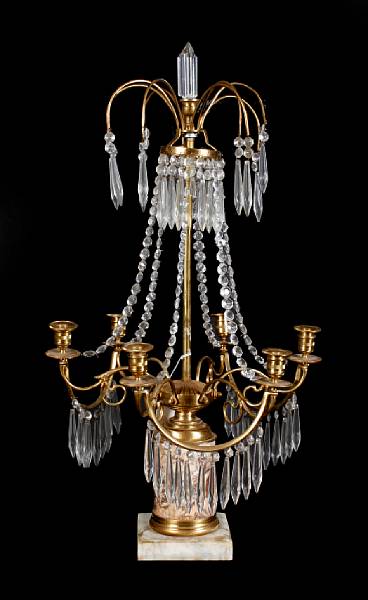 Appraisal: A pair of gilt bronze and crystal six light girandoles